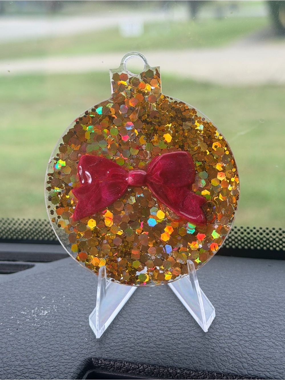 Gold Glitter Holiday Ornament with Red Bow Accent